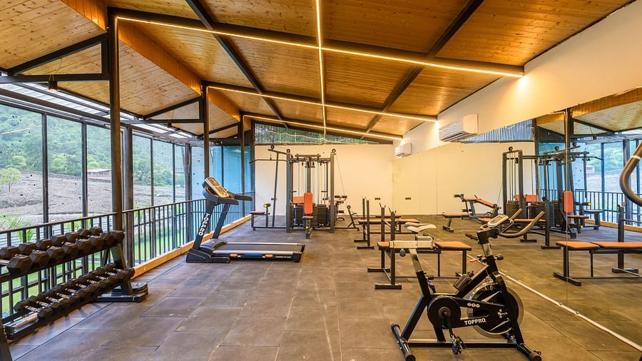 Gym area at DLS Divine River Resort and Spa with various exercise equipments 